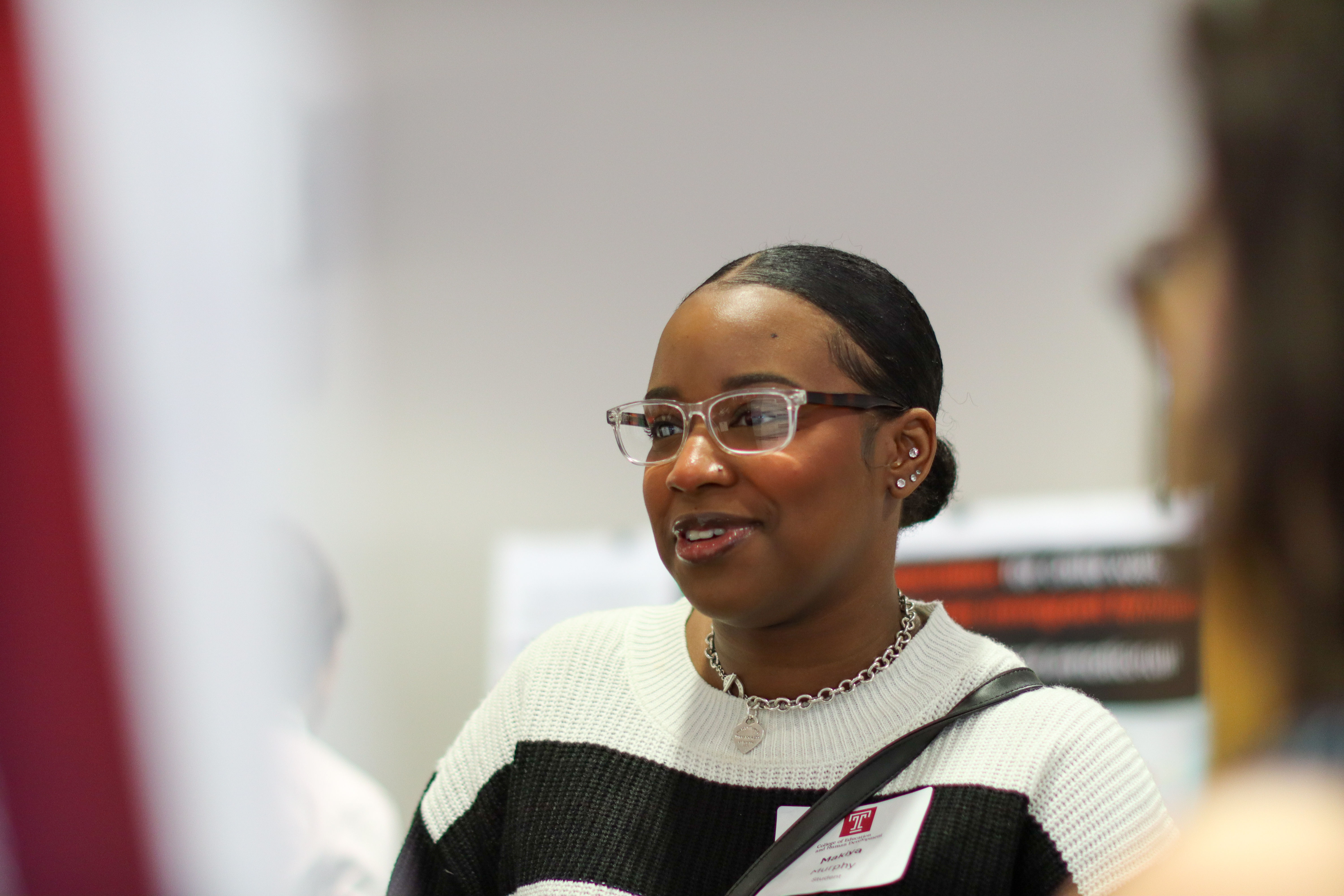 Student talking with others during poster session