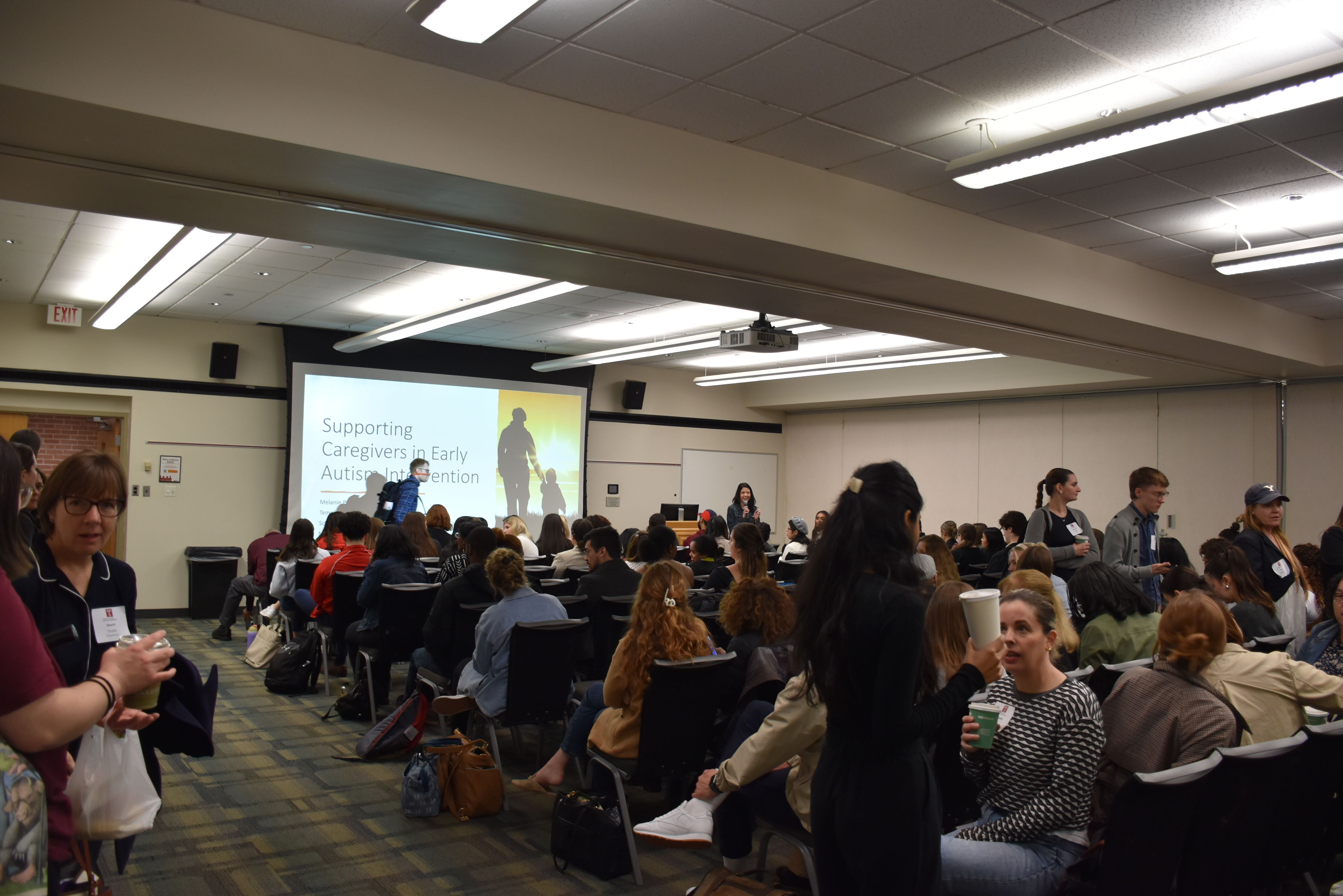 Full room during conference presentation