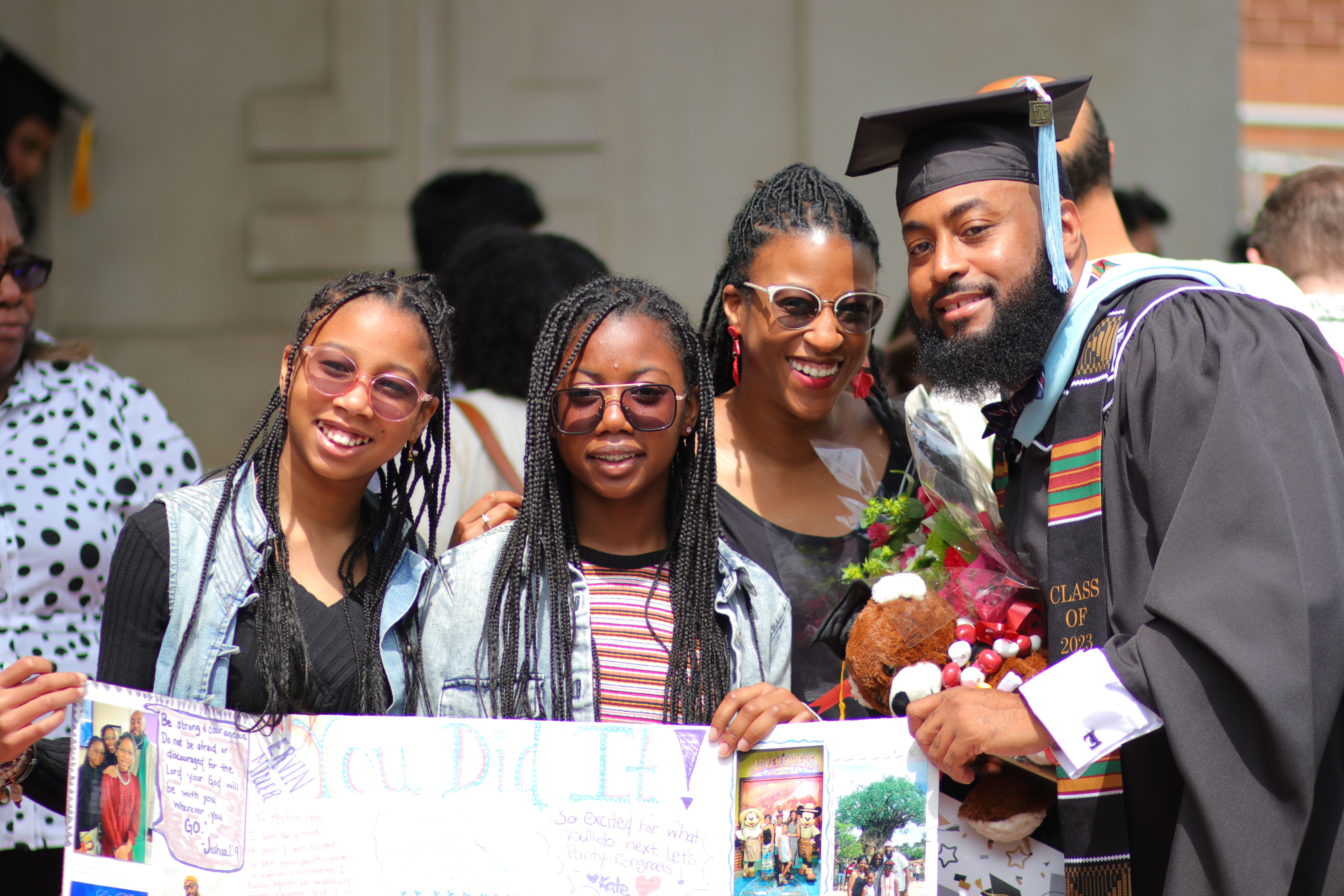 Graduate student poses with family