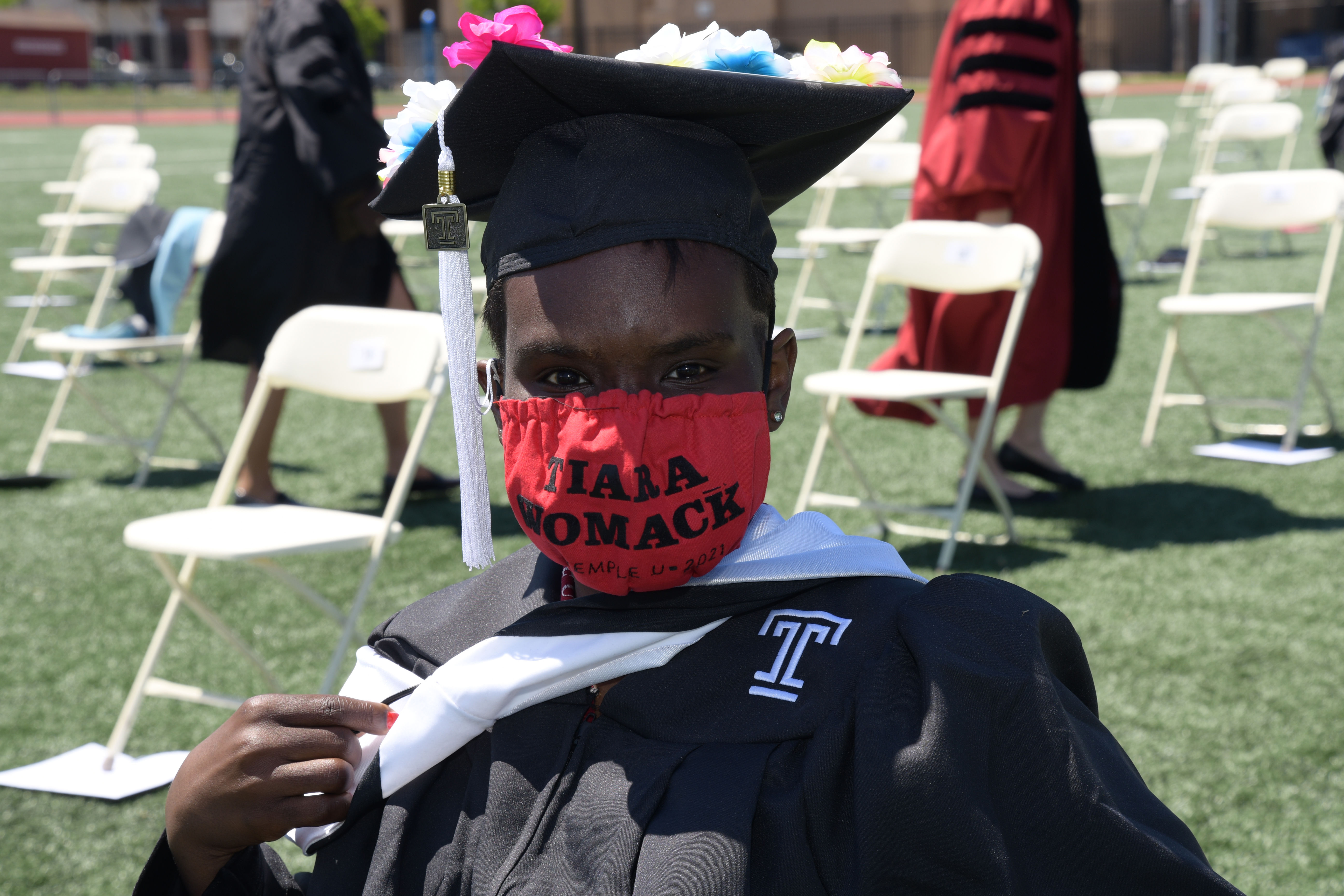 graduate poses for a photo