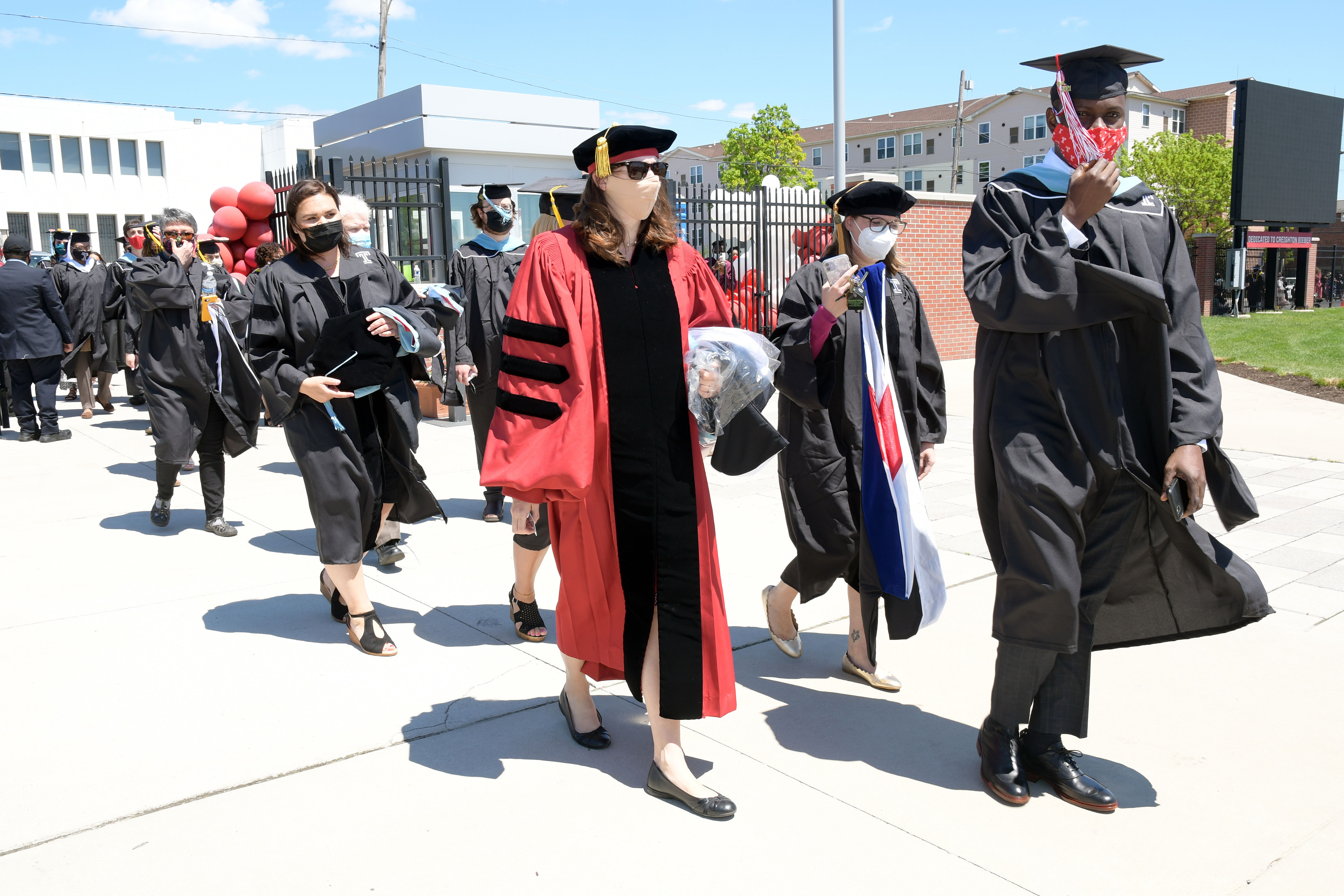 graduates walk into ceremony