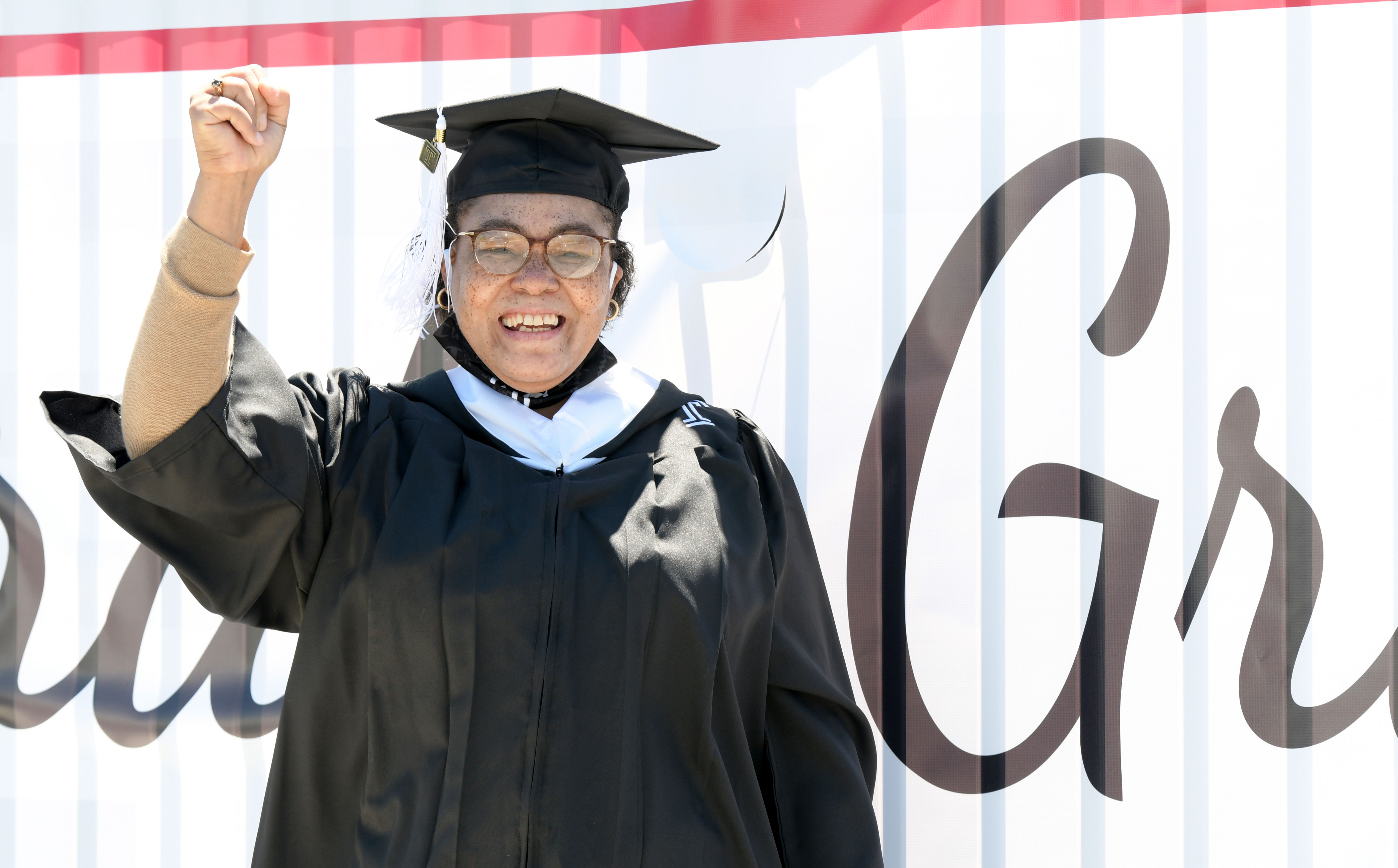 Graduate celebrates outside ceremony