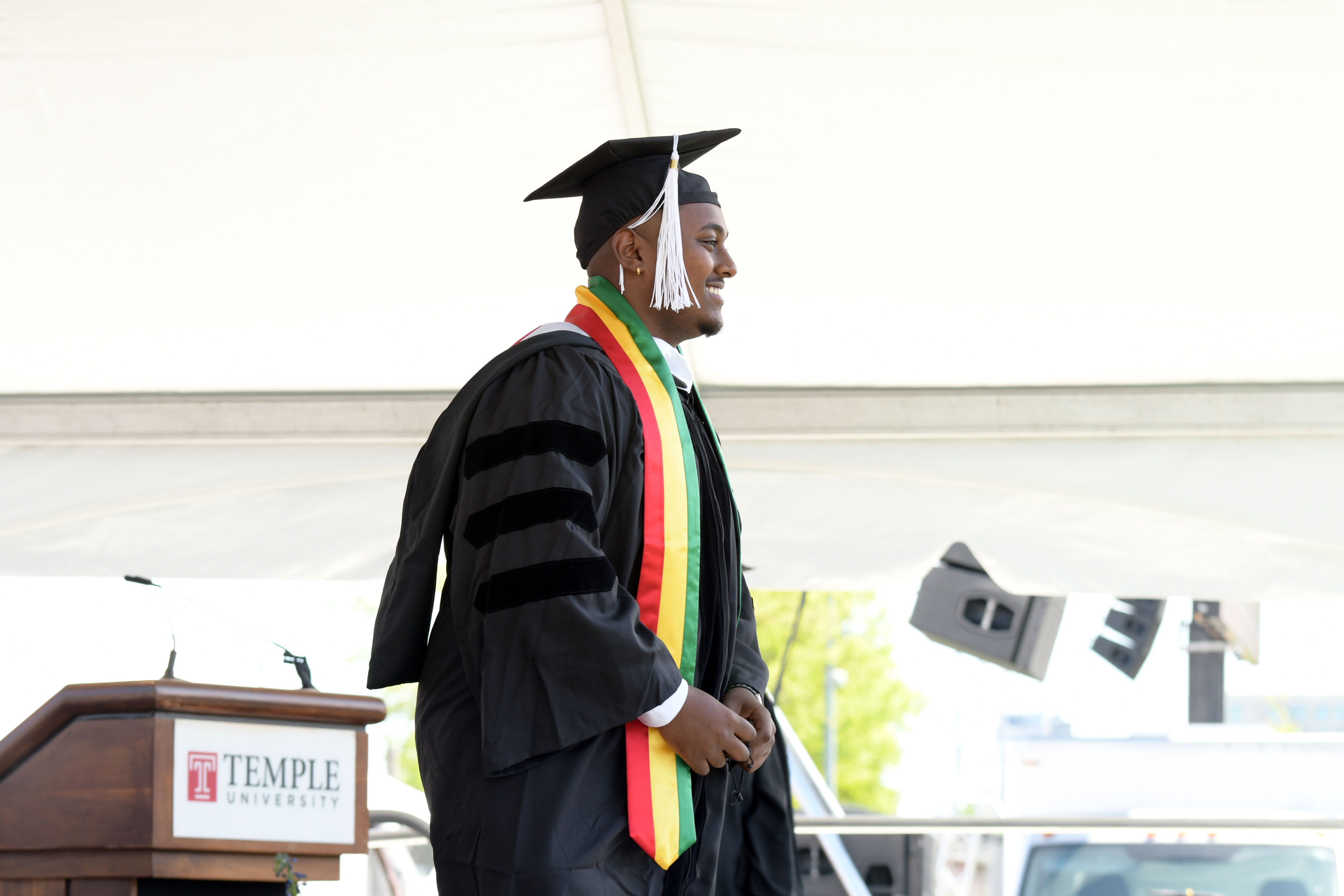 graduate walks across stage