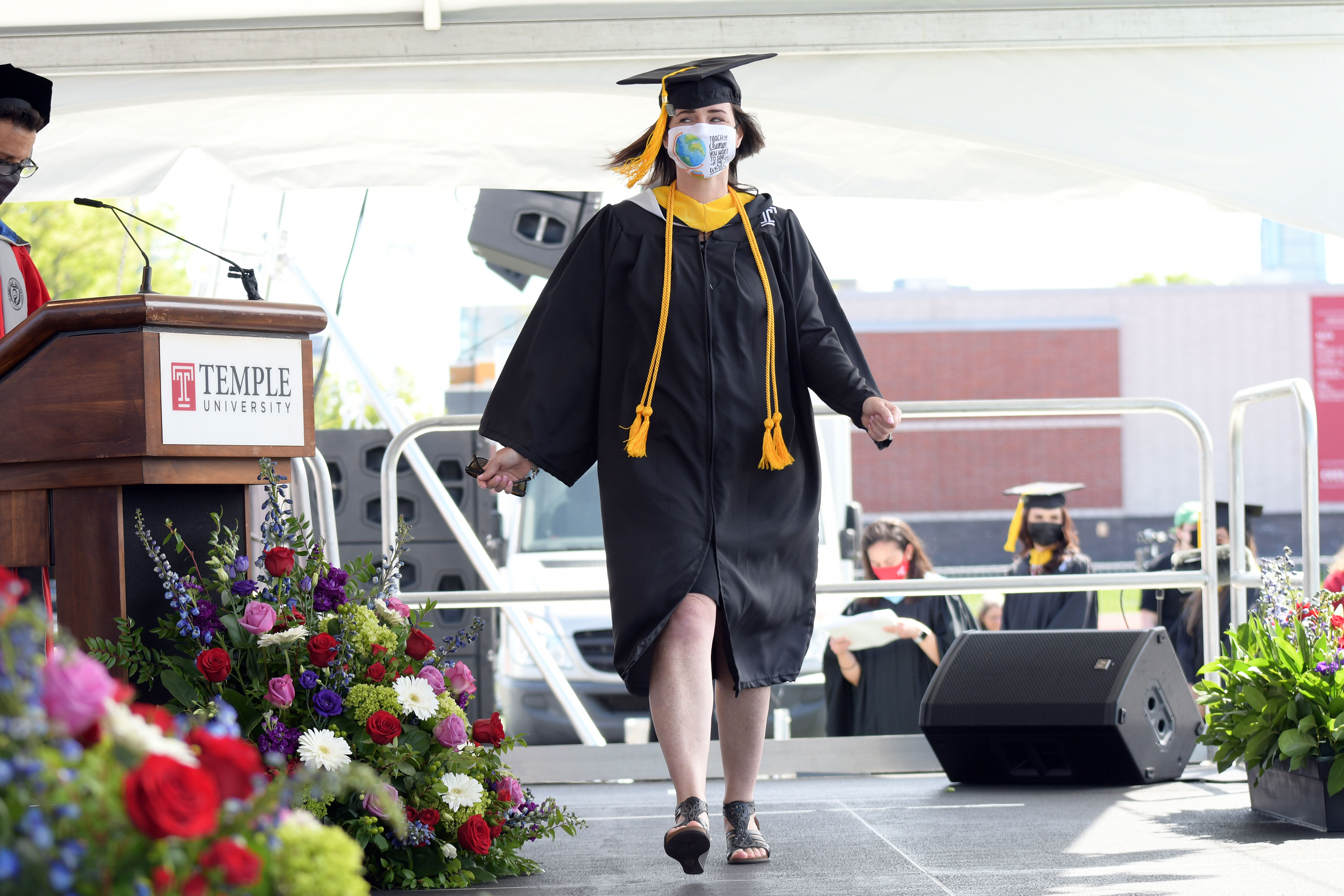 graduate walks across stage