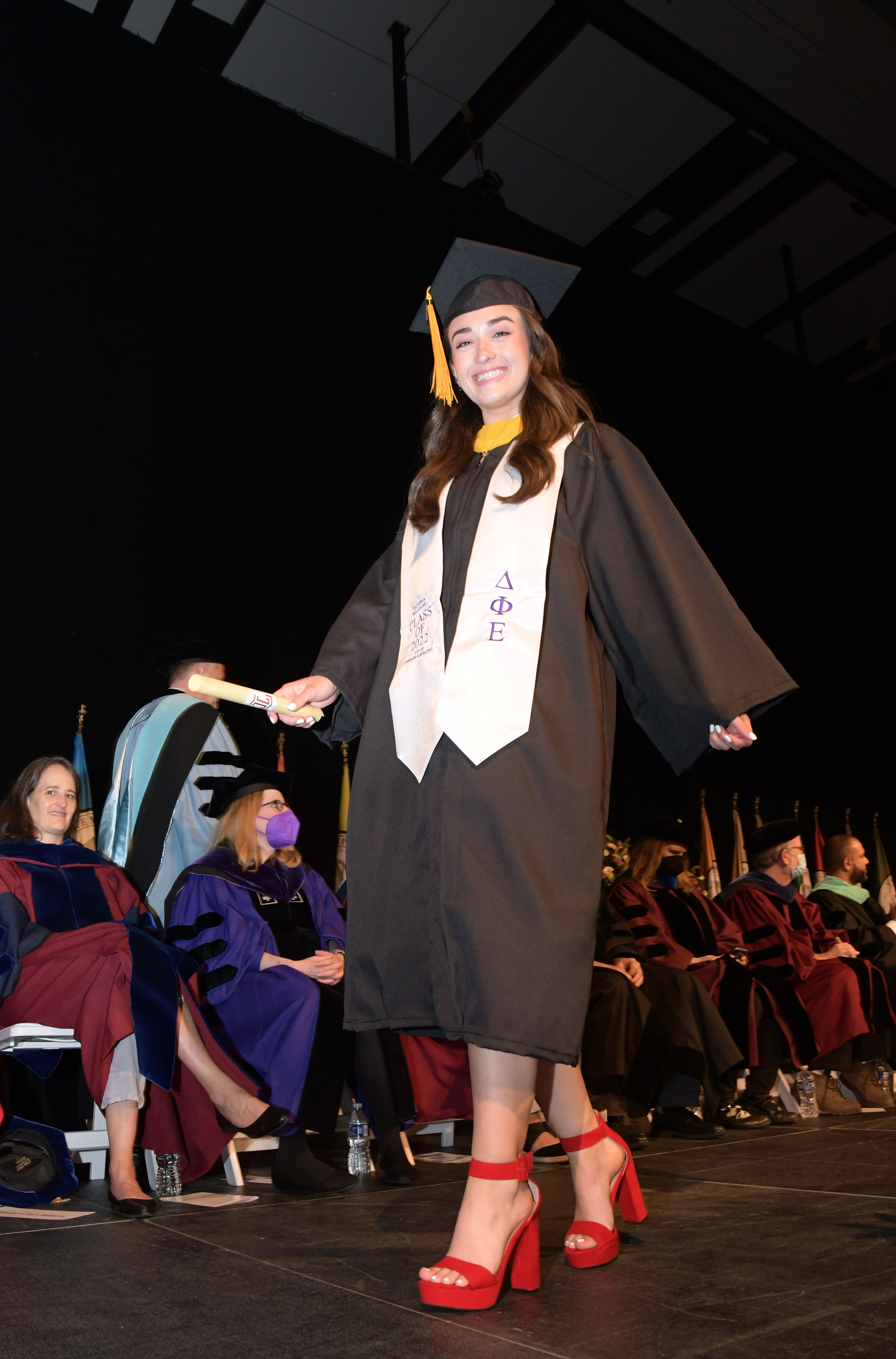 graduate walking across stage