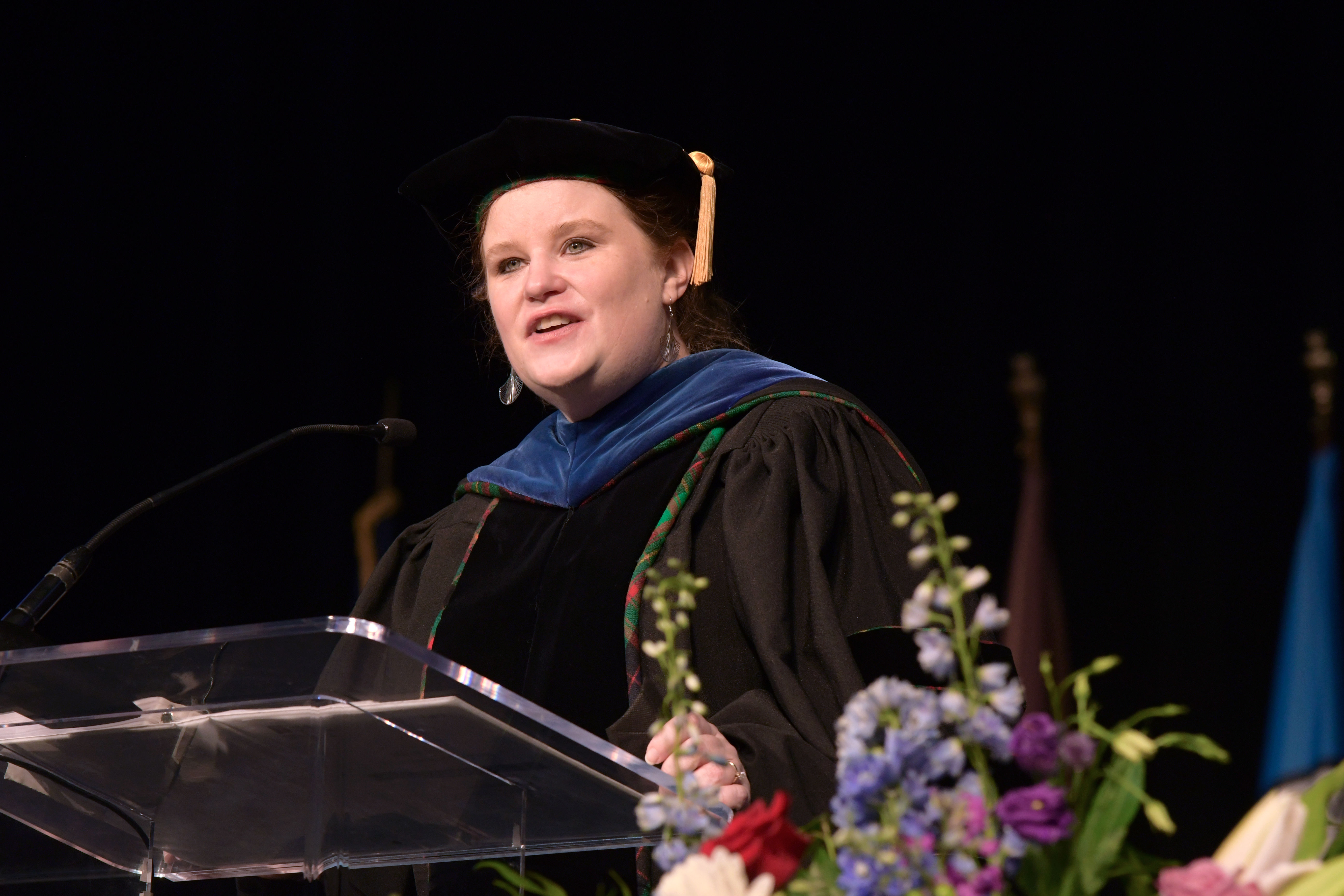 college administrator giving remarks at podium