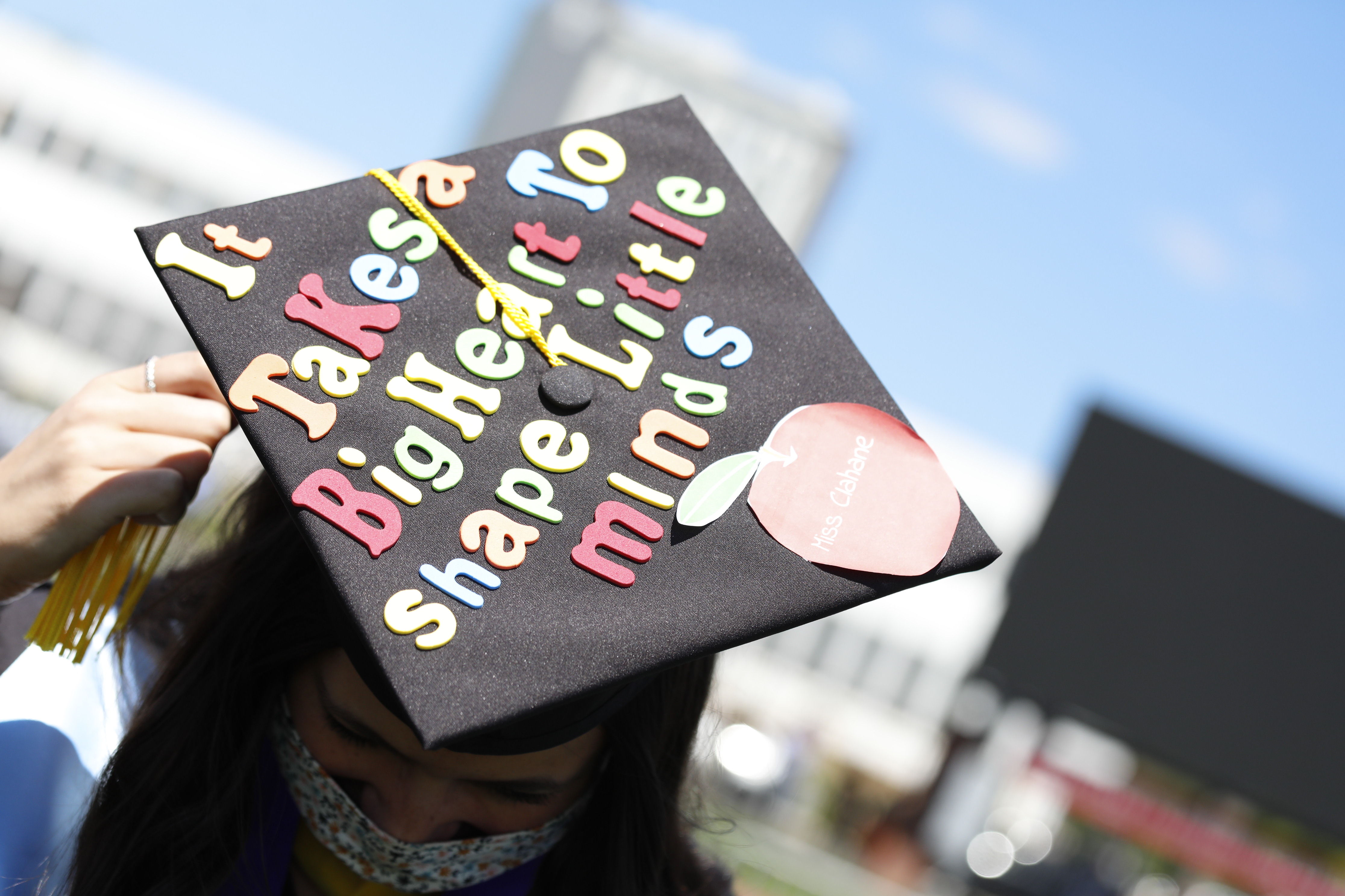 graduation cap with text "it takes a big heart to shape little minds"