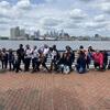children in front of the Philadelphia skyline