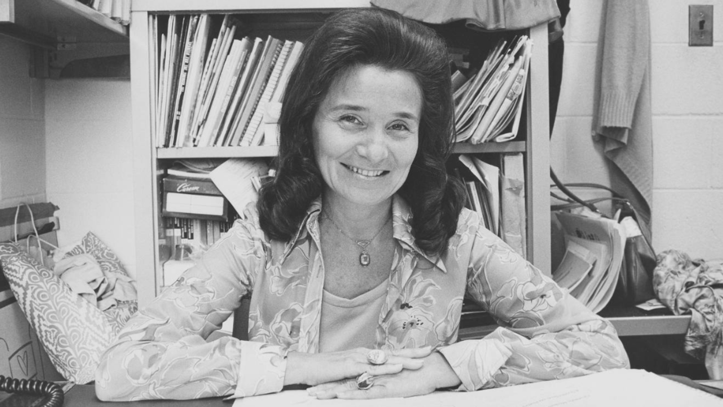 Gertrude Moskowitz sitting at desk posing for photo