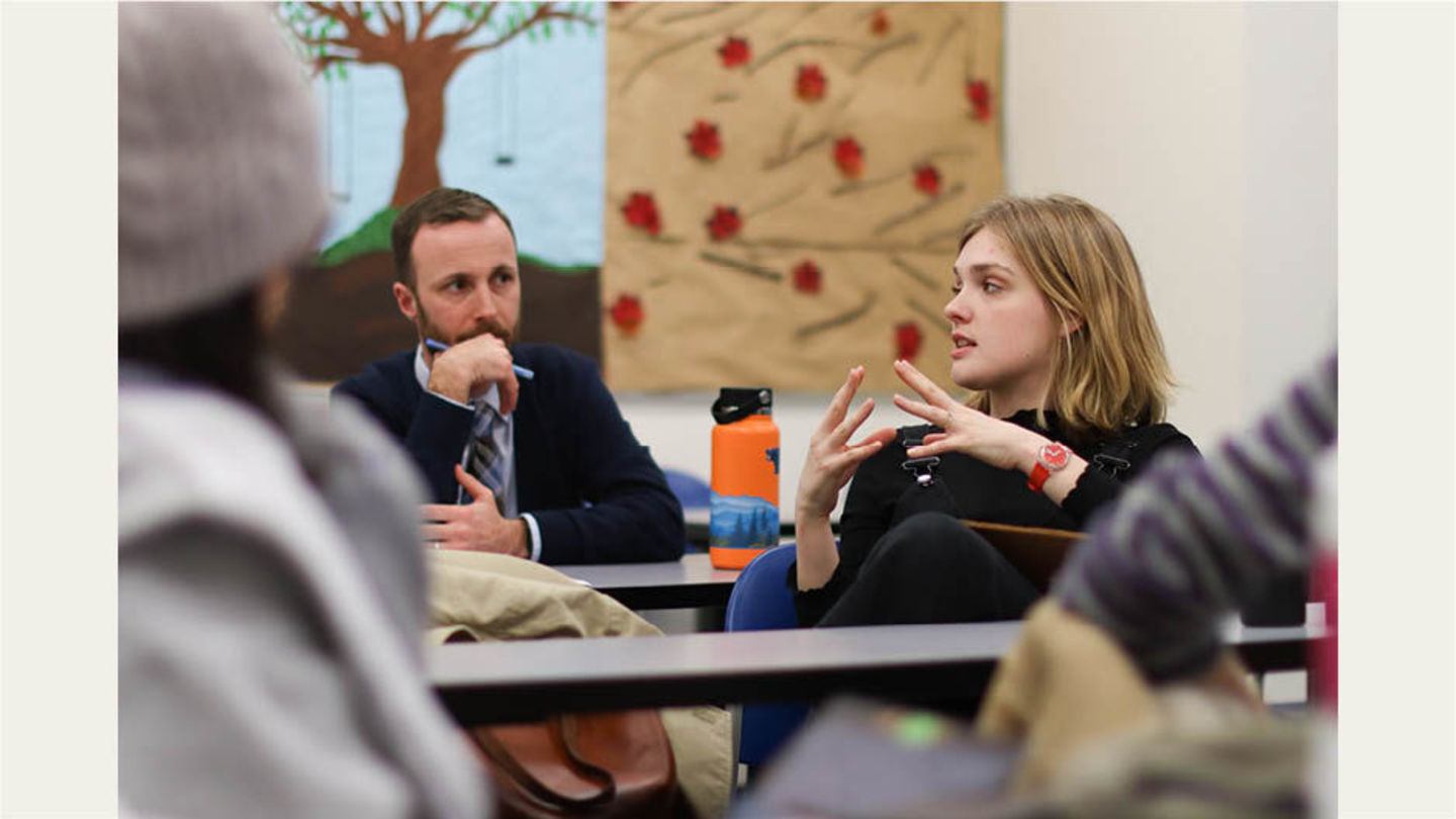 Students in class discussion with Assistant Professor Tim Patterson