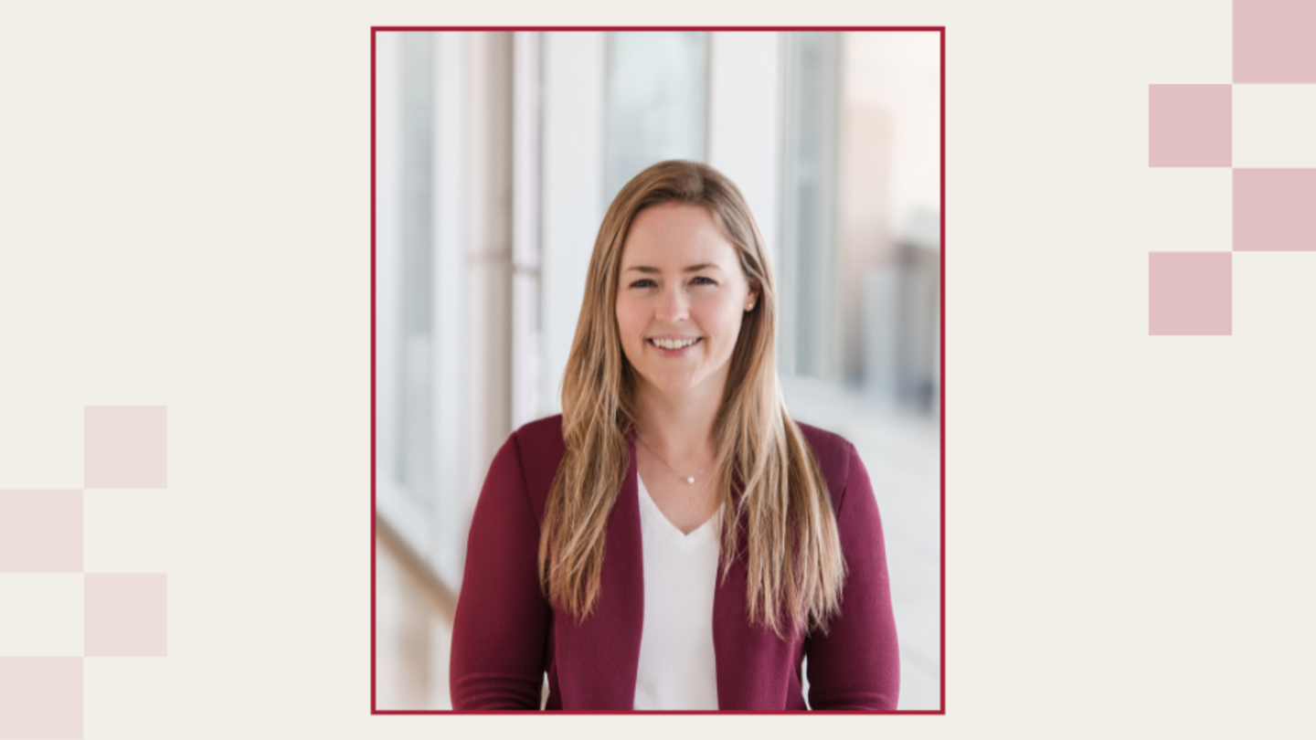 Dr. Katie Smith in a white blouse with burgundy jacket.