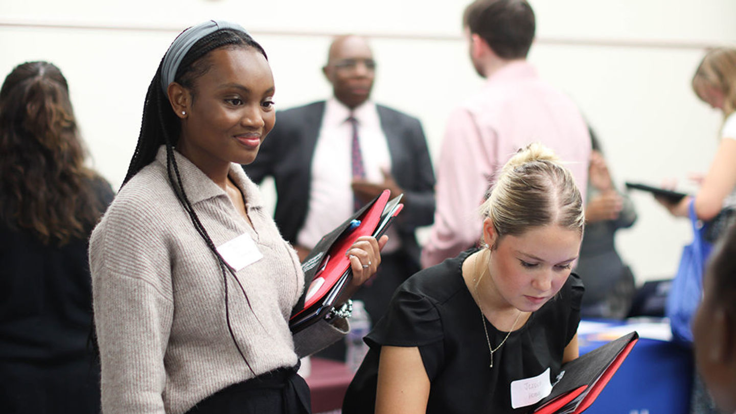 Students engage with employeers at career fair