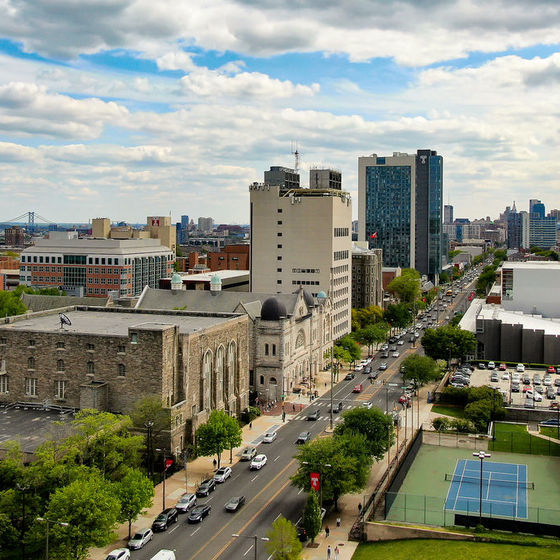 Aerial image looking southward on Broad Street with Temples campus in the foreground and the Philadelphia skyline in the background