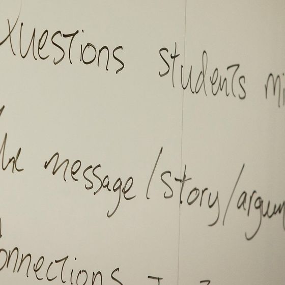 Questions on a White Board in Classroom